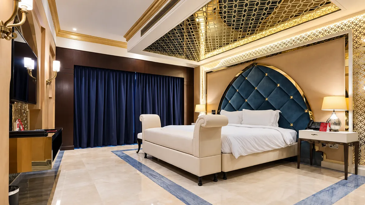 Grand Millennium Jazan — suite bedroom after the ASAS fit-out